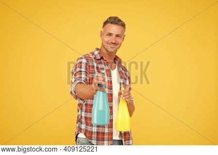 Ready To Spray. Happy Man Hold Spray Bottles Yellow Background. Spray Cleaning. Trigger Sprayer Disp