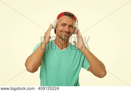 Guy In Cap Listen Music Stereo Headphones. Instrumental Music. Man Headphones White Background. Good