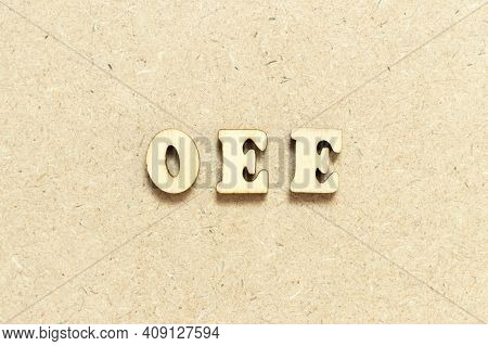 Alphabet Letter In Word Oee (abbreviation Of Overall Equipment Effectiveness) On Wood Background