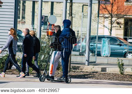 Reims France February 20, 2021 People Rolling With An Electric Scooter In The Streets Of Reims, Oper