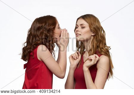Cheerful Mom And Daughter Next To Red Dresses Hugs Lifestyle Light Background Smile