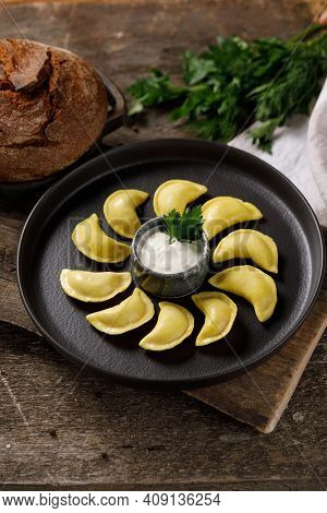 Appetizing Traditional Russian Dumplings Made By Hand With Delicious Filling. Still Life On A Wooden