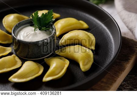 Appetizing Traditional Russian Dumplings Made By Hand With Delicious Filling. Still Life On A Wooden