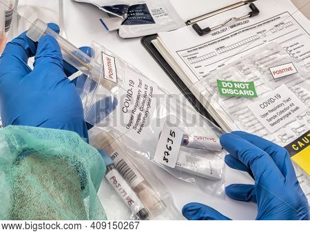 Nurse Analyses Positive Pcr Tests Of Covid-19 In A Hospital Laboratory, Conceptual Image