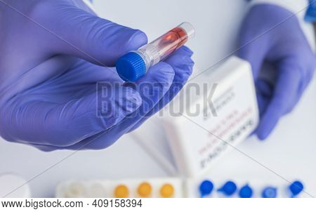 Scientist Examines Sample Of Coronavirus In Laboratory, Conceptual Image