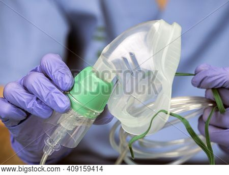 Nurse Prepares Oxygen Mask In A Hospital, Conceptual Image