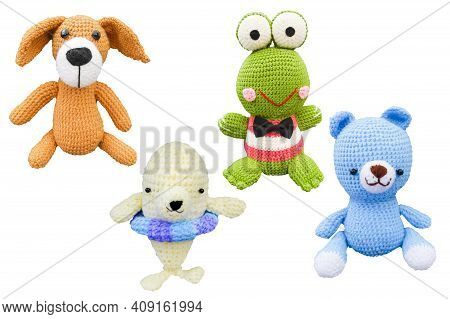 Small Lovely Toy Blue Bear ,brown Dog, White Dophine And Green Frog In Crochet Handmade On White Bac