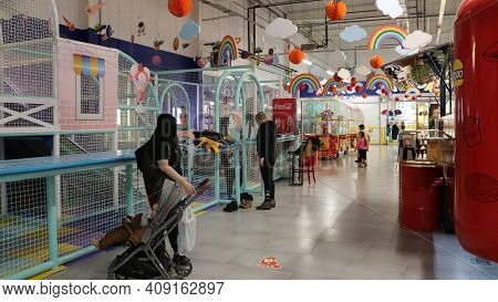 Maykop, Adygea Republic, Russia - February 15, 2021: Children's Playground With Attractions And A La