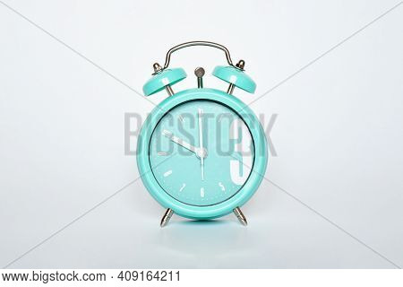 Selective Focus Green Mint Vintage Clock Show 10 O'clock On White Gray Background. Time's Concept.