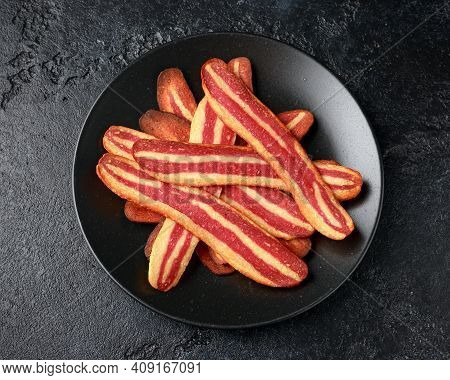 Fried Crunchy Plant Based Vegan Bacon Pieces In A Black Plate