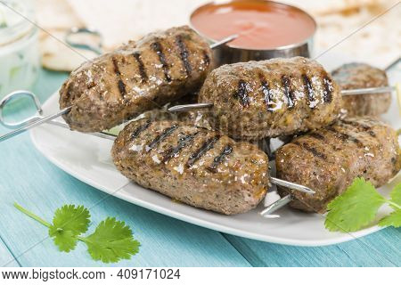 Elicious Burger With Sauce. Hamburger. Delicious Grilled Angus Burger With Cheese, Salad And Tomatoe