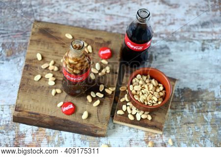 Coca Cola Bottles With Peanuts. Traditional American Snack.