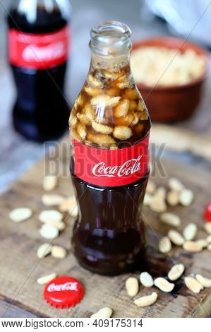 Coca Cola Bottles With Peanuts. Traditional American Snack.