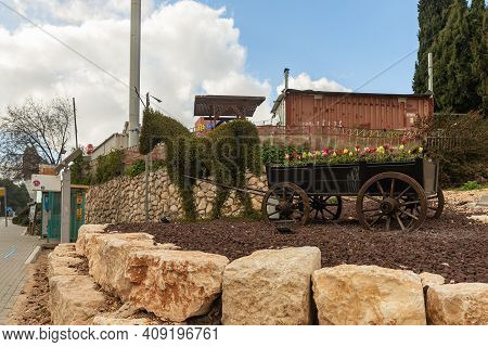 Zefat, Israel, February 13, 2021 : A Flower Bed In The Form Of A Cart With A Horse Stands In The Cit