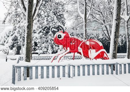 Red Ant In A Children Playground Covered In Snow In A Public Park In Madrid During The Filomena Stor