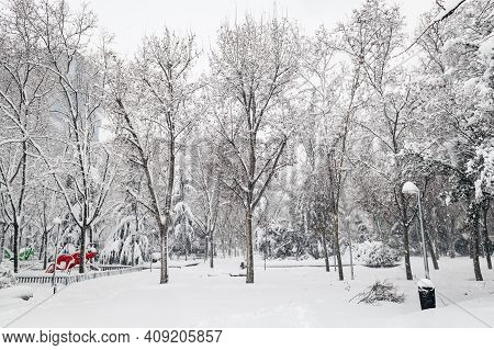 Public Park And Children Playground Covered In Snow In A Public Park In Madrid During The Filomena S