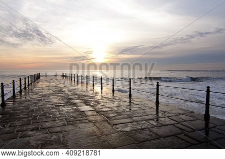 Sunset On A Cloudy Day At Porto