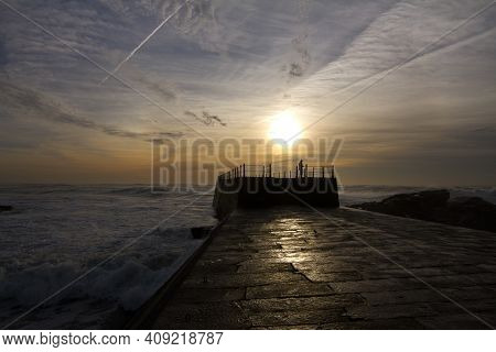 Sunset On A Cloudy Day At Porto
