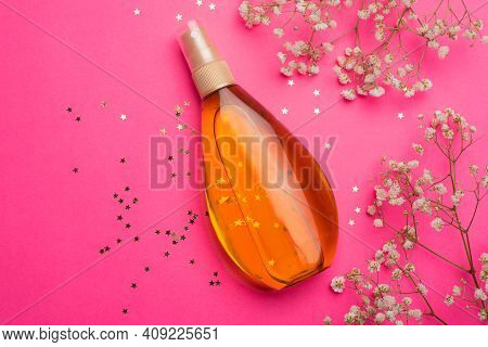 Suntan Oil On A Pink Background. Uniform Tan. A Bottle Of Suntan Oil . Protection Of The Skin. Vacat