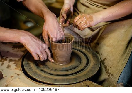 Pottery Classes, Student Making Clay Pot On Wheel. Close-up Of Dirty Hands, Sculpting Clay Crockery