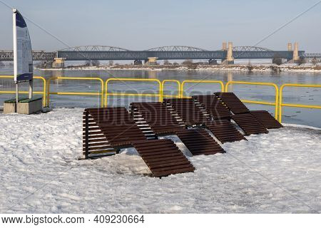 Tczew, Poland - February 21, 2021: Relaxation Zone On The Riverside Promenade In Tczew. The Historic