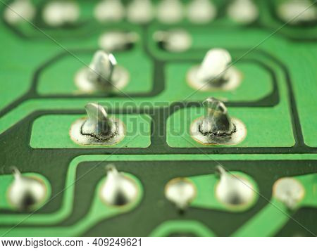 Failed solder joints. Cracked or broken solder joints, due to stress, fatigue, vibration. One of the common causes for vintage electronic equipment failures. Shallow DOF due to high magnification.
