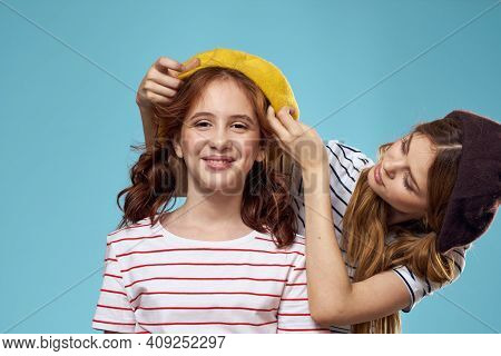 Mom And Daughter Striped T-shirts Hugs Fun Lifestyle Blue Background