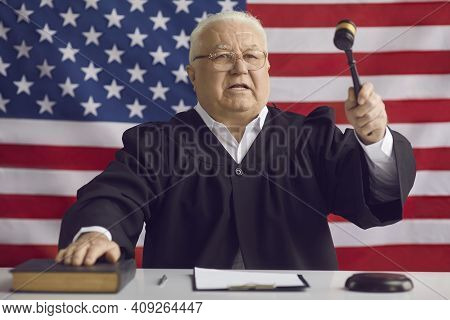 Senior Man Professional Judge Announcing Verdict During Court Case With Hammer