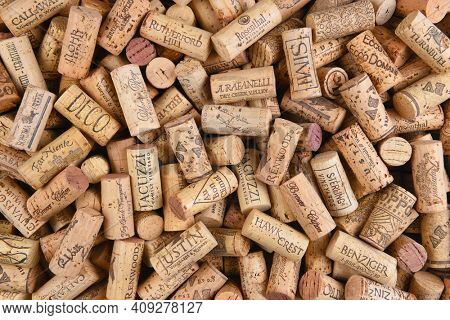 IRIVNE, CALIFORNIA - FEBRUARY 14, 2018: A pile of Predominently California wine corks with a variety of logos and names. 