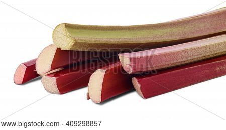 Bundle Of Thick Reddish Stalks Of Rhubarb (rheum Rhaponticum) Isolated On White Background.