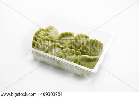 Green, Spinach Pierogi, Dumplings On A Plastic, Transparent Food Tray, Isolated On A White Backgroun