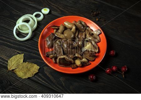 Suillus Luteus Or Boletus Luteus Mushrooms Marinated In Plate With Spices And Onions On Vintage Tabl