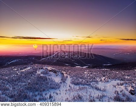 Colorful Winter Sunset In Sheregesh Ski Resort Mountains With Clouds. Aerial Top View Forest Russia