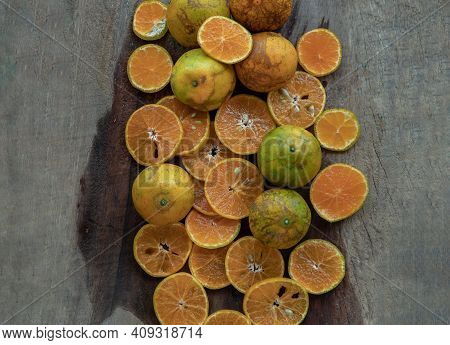 Fresh Orange Fruits On The Old Wooden Table. Tangerine Phurua Species, Juicy Orange Sour And Sweet, 