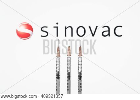 Izmir, Turkey - February 21 2021: Coronavirus Vaccine Concept And Background. Sinovac Vaccine Syring