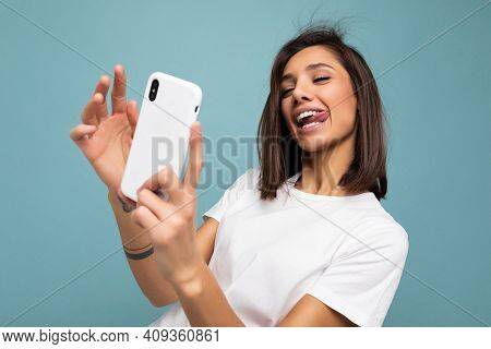 Photo Of Sexy Beautiful Smiling Happy Young Brunette Woman Wearing Casual White T-shirt Isolated Ove