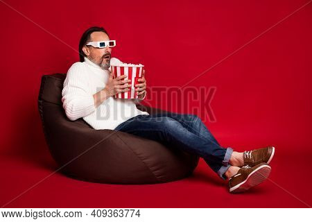 Full Size Photo Of Mature Scared Anxious Frightened Man Watch 3d Horror Film Eat Pop Corn Isolated O