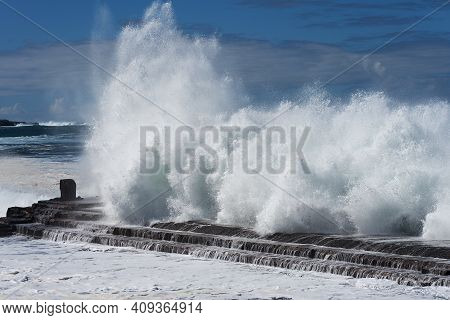 A Great Wave Crashing On A Day Of Rough Ocean