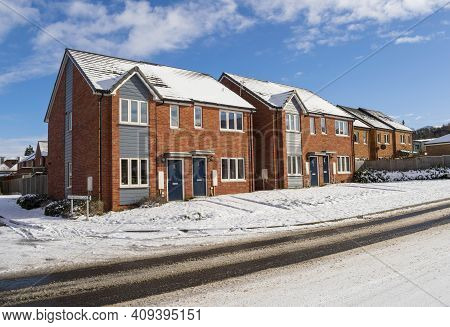 Grantham, England - February 10, 2021. Hathersage Close Buildings And Street View On A Snowy Day Wit