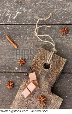 Pieces Of Chocolate, Cinnamon Sticks And Star Anise On A Wooden Board, Photo Rusticstyle