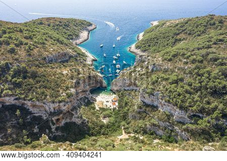 Aerial Drone Shot Of Yachts At Stiniva Cove Beach Of Adriatic Sea On Vis Island In Croatia Summer