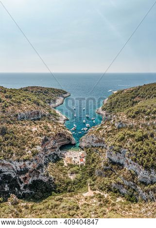 Aerial Drone Shot Of Iconic Stiniva Cove Beach Of Adriatic Sea On Vis Island In Croatia Summer