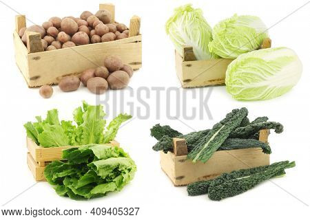 Freshly harvested cooking vegetables in wooden crate on a white background