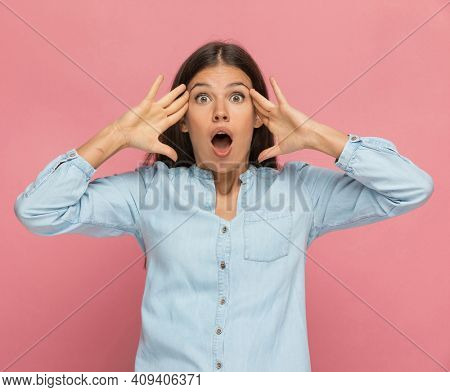 beautiful casual woman having her mind blown due to an overload of information 