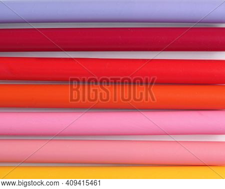 Many Purple Red Pink And Yellow Felt Tip Pens On A Table
