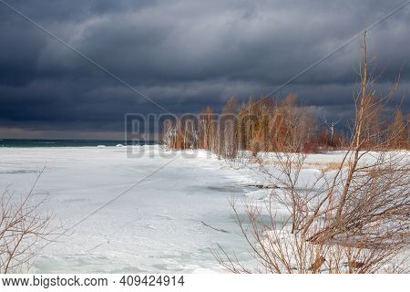 A Winter Storm Approaches The Shores Of Southern Georgian Bay In Lighthouse Point, Collingwood. Ice 