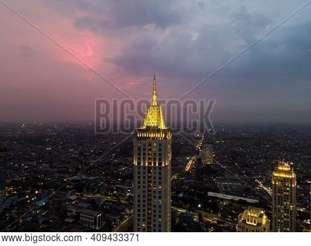 Pakubuwono Skyline Aerial Drone View From Above At Night, Jakarta Downtown Skyscrapers Cityscape And