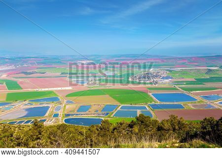 Jezreel Valley in the Lower Galilee, Israel. Warm winter in israel. Picturesque agricultural fields cover the entire valley
