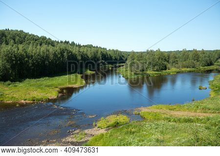 View of the forest and river in summer in the North Russia.
