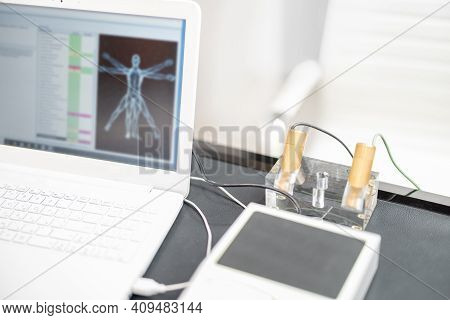 Bioenergetic Testing Device With Brass Handpieces In Medical Clinic